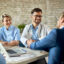 happy doctor shaking hands with a businessman on a meeting in th