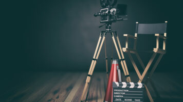 video, movie, cinema concept. retro camera, clapperboard and director chair. 3d